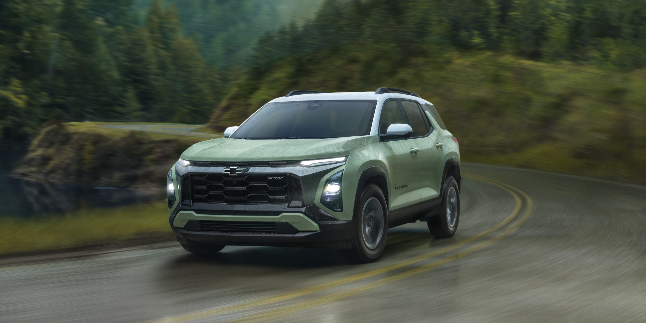 Enjoy your drive with top Chevrolet SUVs, 2025 Equinox driving along a winding mountain road.