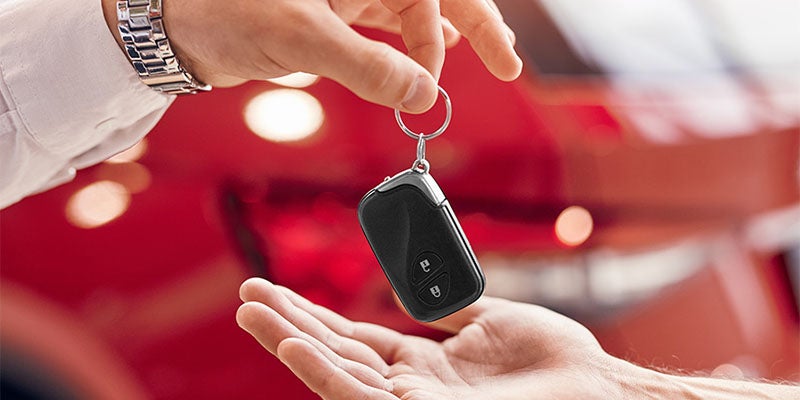 sales rep going over paperwork with customer from Fitzgerald Chevrolet of Hagerstown in Hagerstown MD 